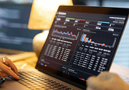 computer with graphs on screen